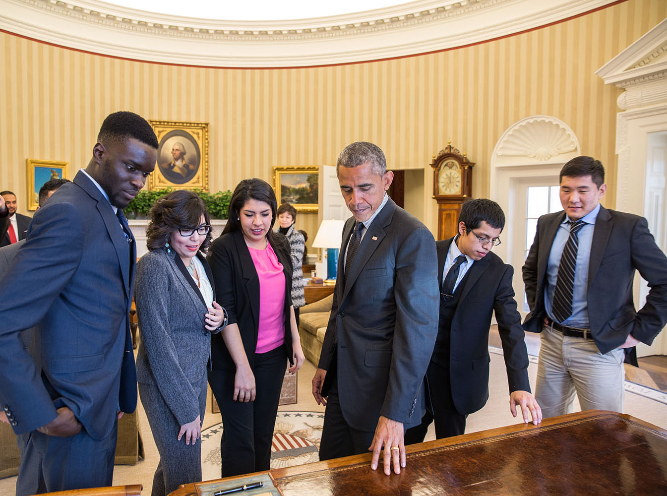 President Barack Obama shows the Resolute Desk in the Oval Office to a group of DREAMers, Feb. 4, 2015. (Official White House Photo by Pete Souza)