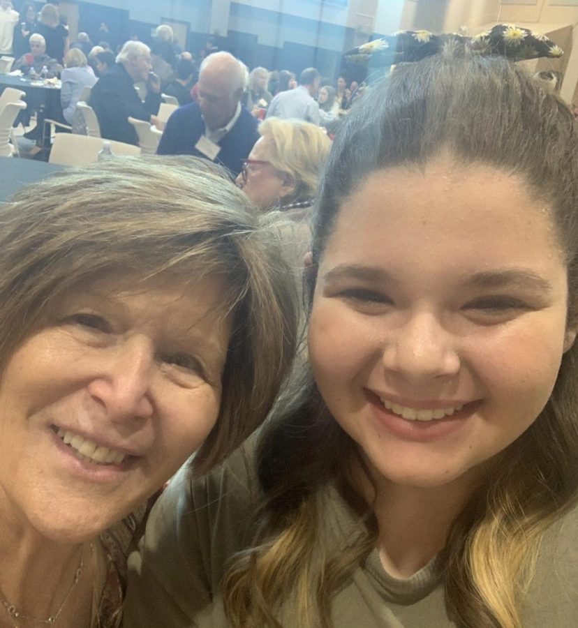 Maddy sits with her grandmother on Generations Day.