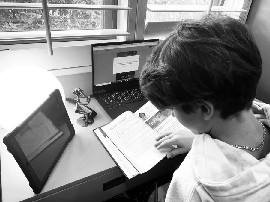Sixth grade student Miles does his six hours of online school from home.