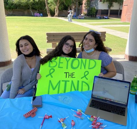 From left: Leaelle G. (23), Michelle S. (22), Yarden M. (22) host the Beyond the Mind booth, whose club mission is to fight the stigma against mental health and teach its members how to deal with stress.