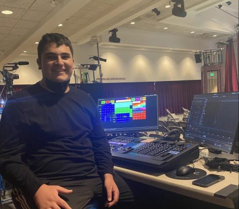 Josh R. (23) runs the light board for the production of Chicago Feb. 27- March 6, 2022.