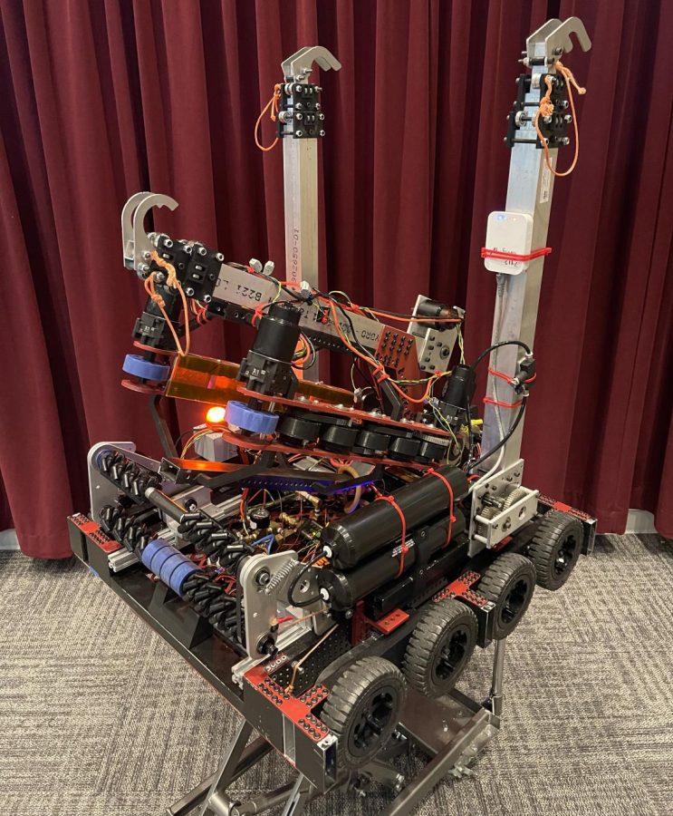 The robot, designed, built, and coded by the students in less then nine weeks shoots balls nine feet in the air and uses claws to lift the 150-lb robot off the ground, wrote Robotics Adviser William Cornell in an email March 28, 2022.