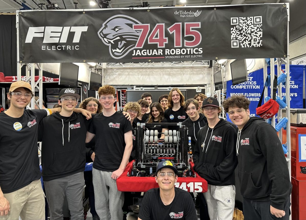 Robotics team members won their first playoff match in team history in competition March 17-18, 2024, placing third out of 44 teams. (From left) Julian L. (25), Levi G-C (27), Micah S. (27), Oren Z. (27), Zach T. (27), Harrison B. (25), Seth G. (24), Lauren S. (24), Gabe N. (25), Zeve Z. (24), Uri C. (25), Rowan G. (26), Jake T. (27), Alex B. (26), and (center) Ben R. (25) - Photo courtesy of Jaguar Robotics