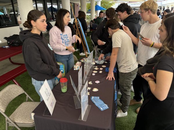 Lielle T. (‘26) promotes the Teen Talk organization which gives emotional support for kids who are undergoing depression and suicidal thoughts Friday, Nov. 15, during the mental health fair.