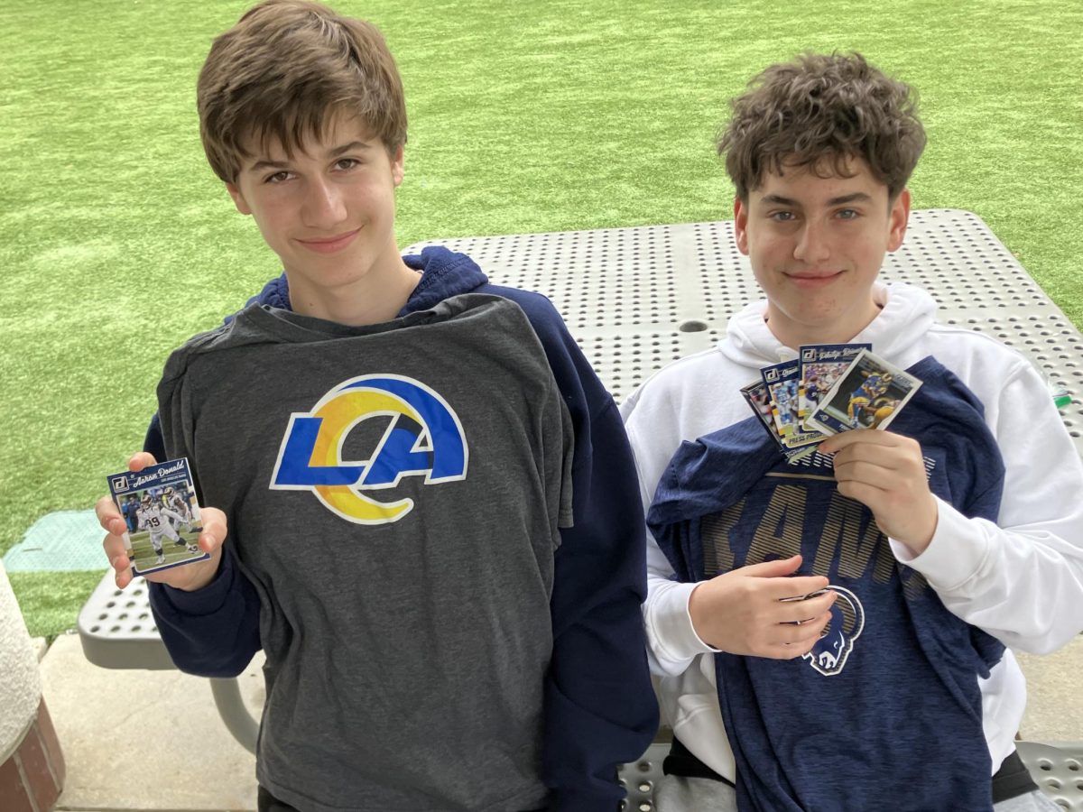 Max M ('28) and Jonah S ('28) showing off their Rams shirts and football cards on Jan. 30.