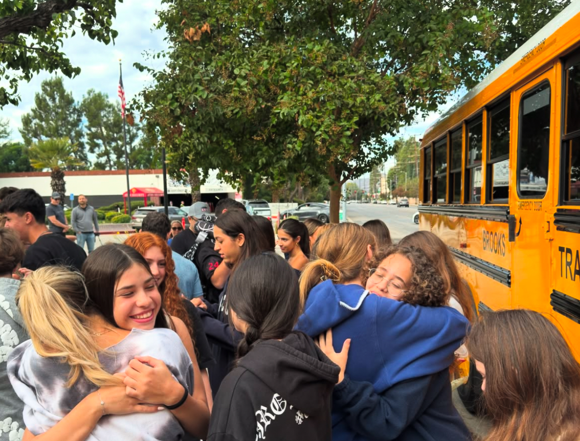 Friends gather outside dTHS on Oct. 27, 2024, as Israeli buddies get ready to leave for the airport to travel home after a six-week exchange program.