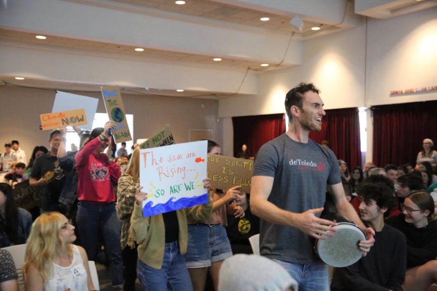 de Toledo students and faculty, including Rabbi Bubis on the drum, demonstrate the need for change before their peers at Town Hall. 