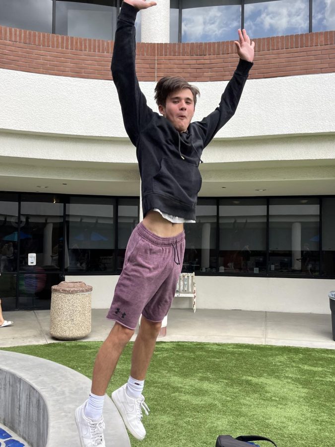 Jake S. ‘24 jumps for joy during bonus in the courtyard. 
