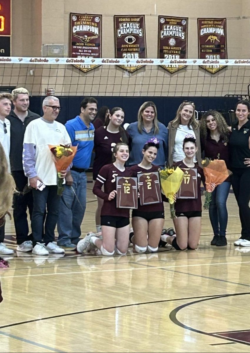 de Toledo senior volleyball players (left to right) Sage P., Jessie L., and Sammy K. celebrate Senior Night at a home game Oct. 2, 2023, vs. Le Lycee Francais de Los Angeles.