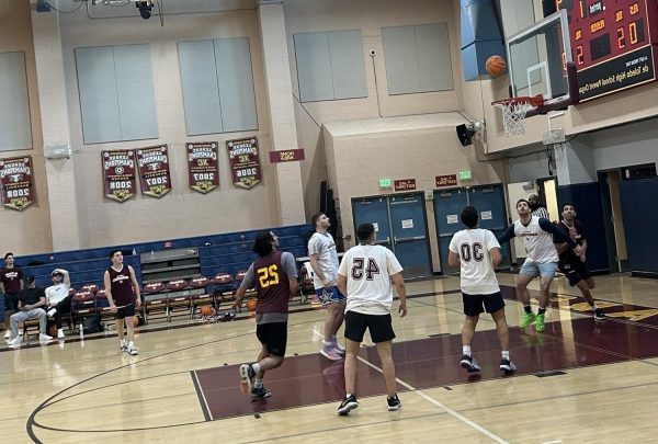 dTHS alumni battle it out in a heated reunion on their home court during the annual Alumni Basketball Game Nov. 22, 2023. 