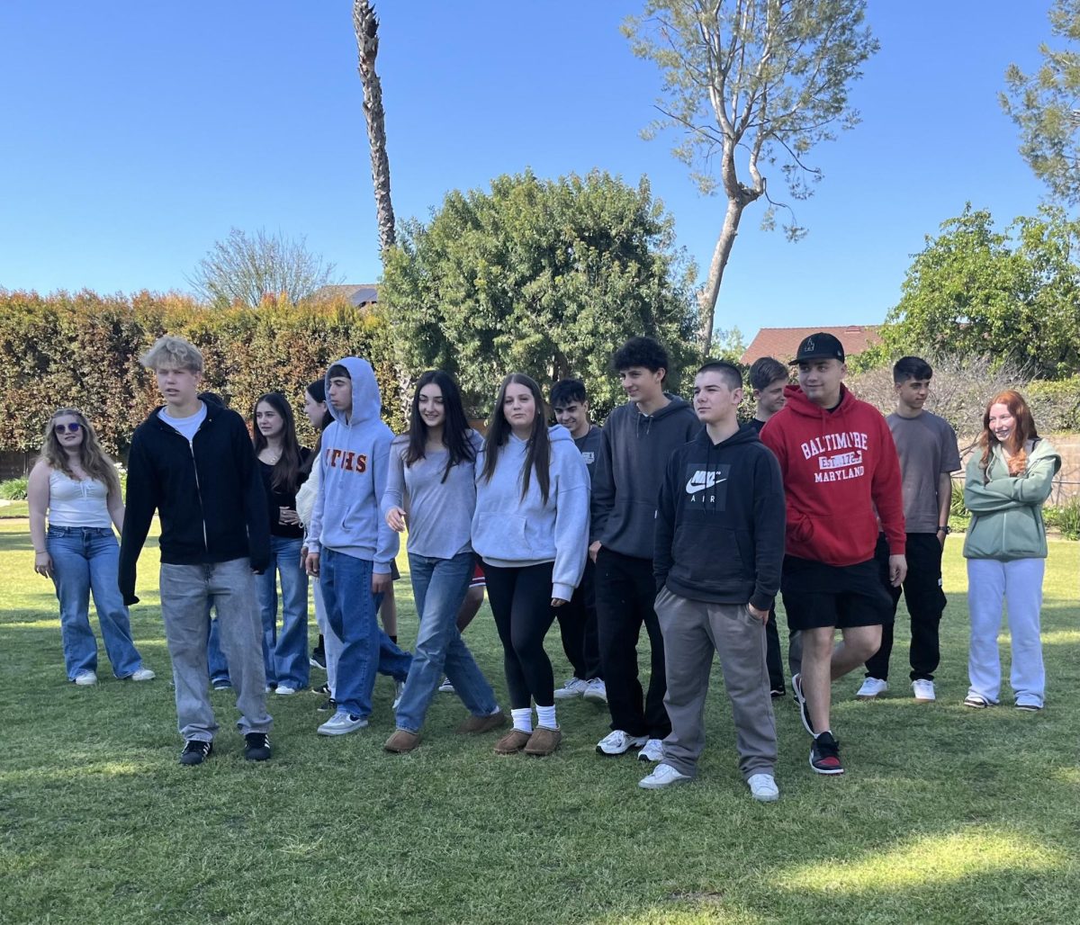 dTHS hosts welcome their Israeli guests in a dance of happiness and friendship on campus March 21, 2024. (Front row, left-right) Lily S., Kadyn M., Owen K., Lila K., Ilana L., Shayne M., Evan K., and Gabe K. 