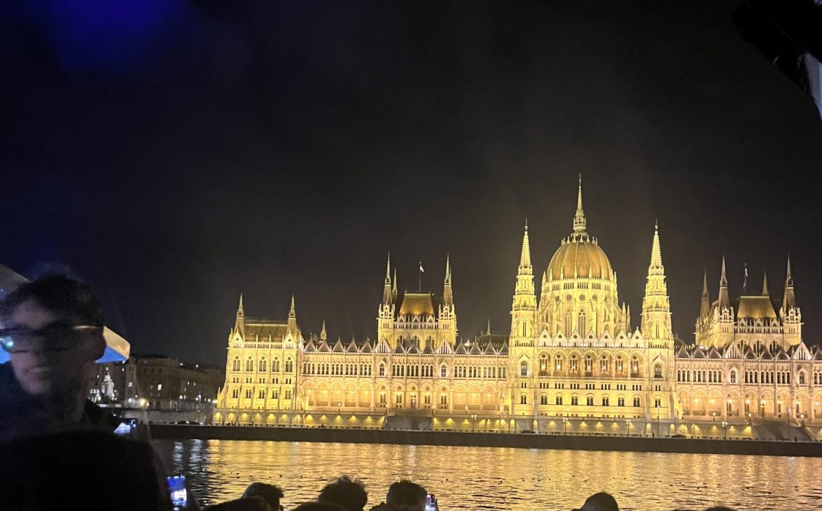 The Parliament building of Budapest, Hungary, lights up the night from a tour boat on the Danube River, separating cities Buda and Pest (March 11, 2024). 