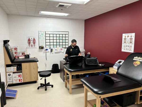 Hubert Paz, de Toledo's athletic trainer, helps student athletes with injuries in his office off the gym Sept. 26, 2024.