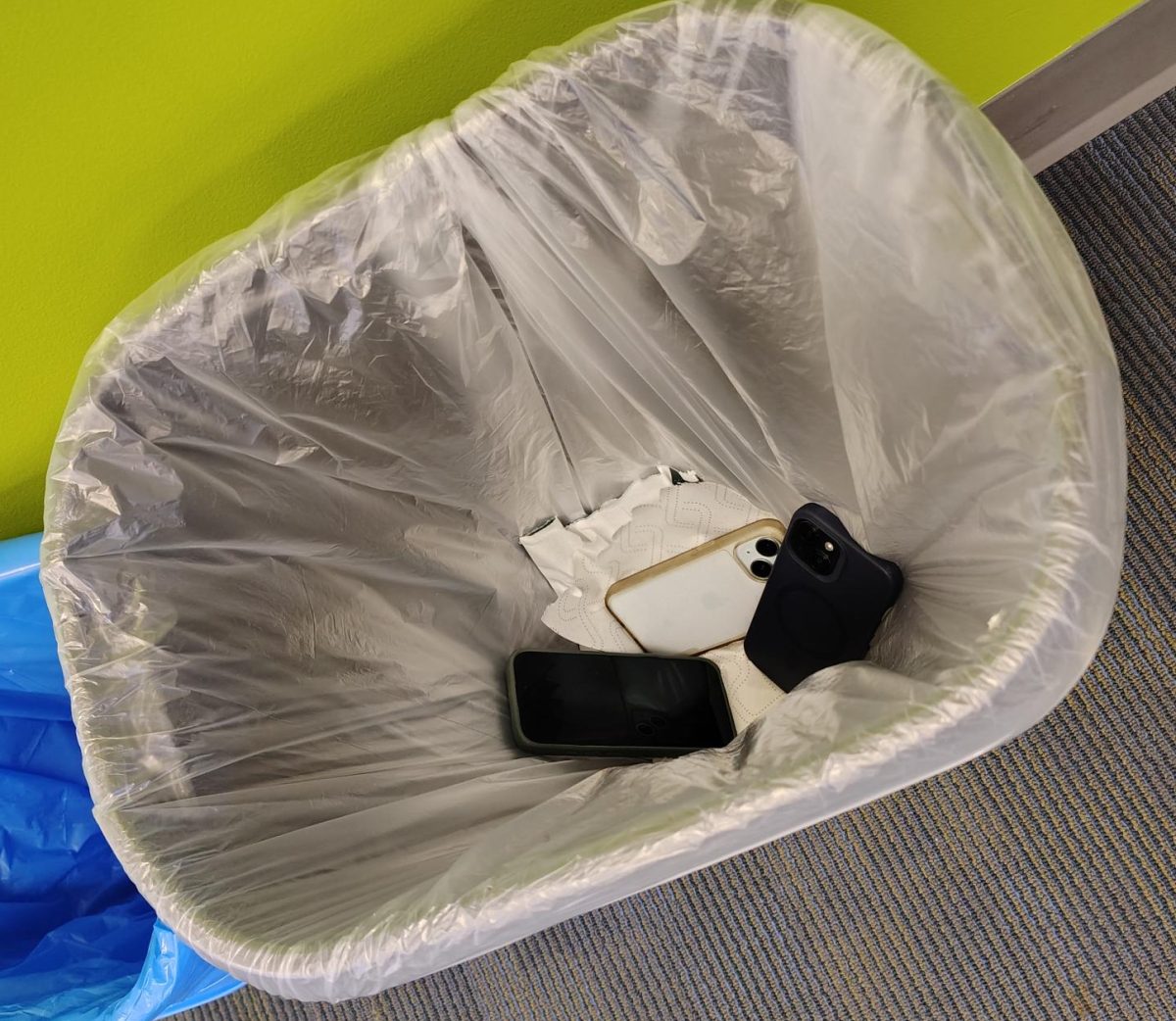 Students' phones get thrown in the trash after being caught using them.