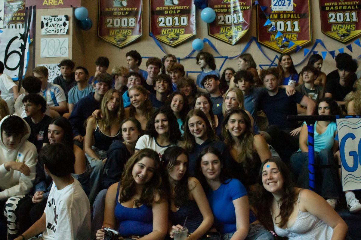 dTHS juniors on the bleachers at a spirit rally on 12 September.