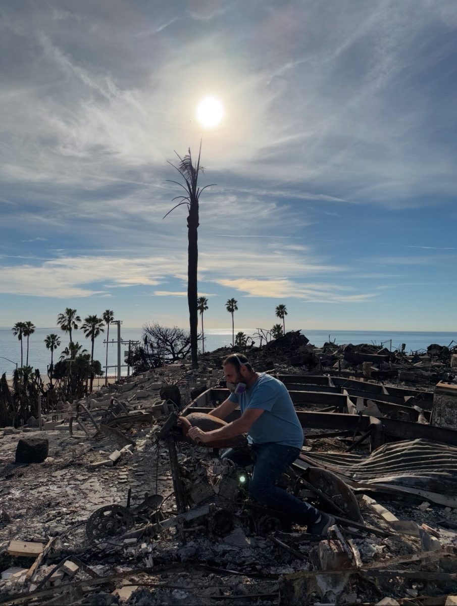 Nomi M.'s father on his motorcycle, destroyed in the fires.