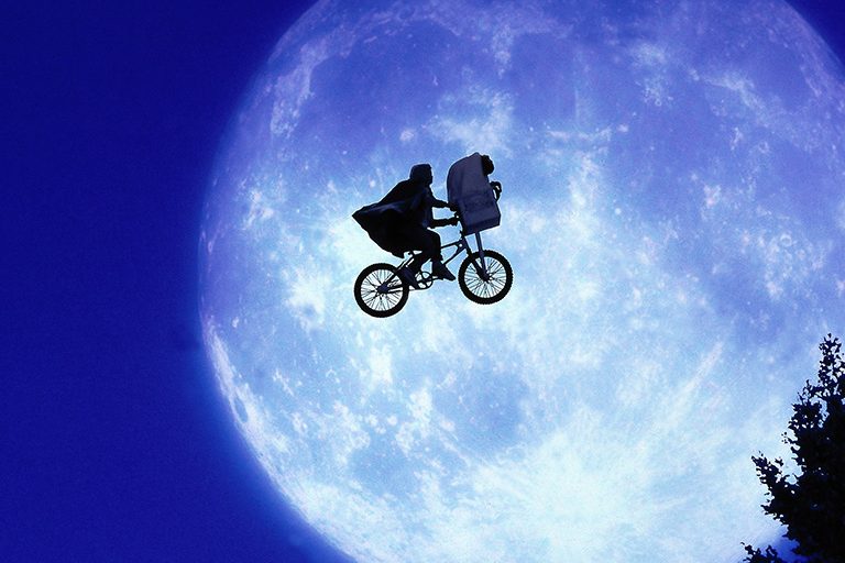 Iconic image of Elliot and E.T. on the run in the film E.T. by Steven Spielberg.