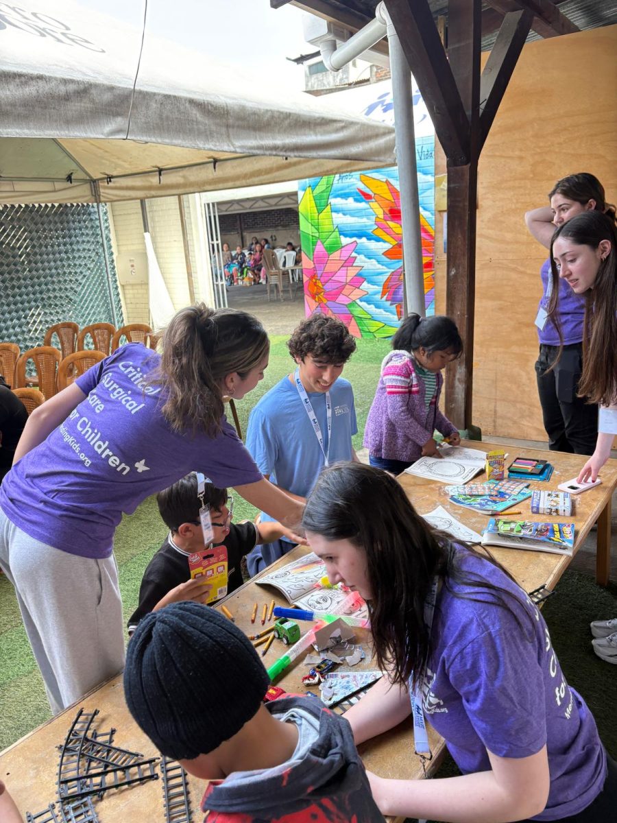 dTHS students doing arts and crafts with Guatemalan children on the Guatemala ENT Medical Mission