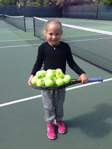 Author Shelby L. seen playing tennis as a young girl.