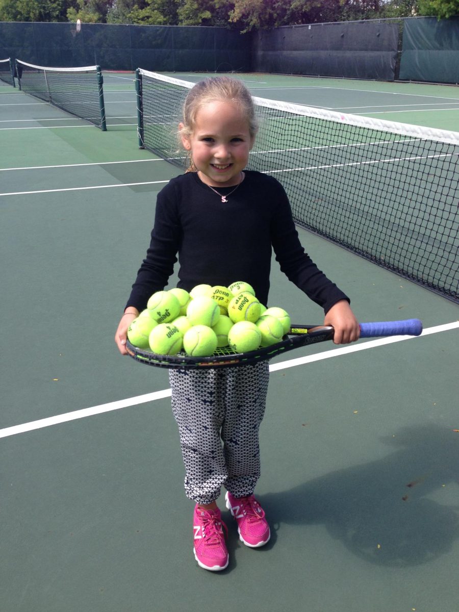 Author Shelby L. playing tennis as a young girl.