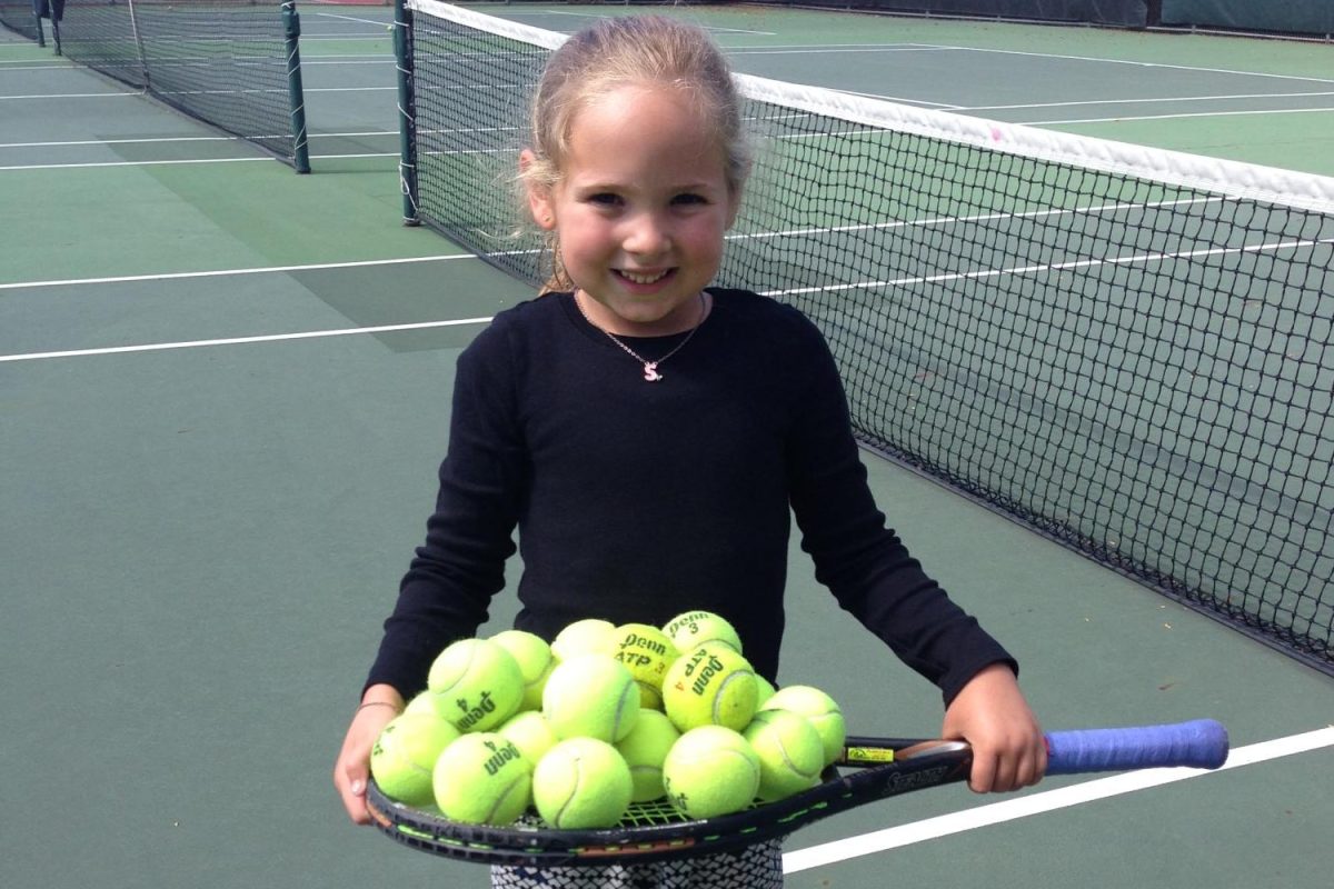 Author Shelby L. seen playing tennis as a young girl.