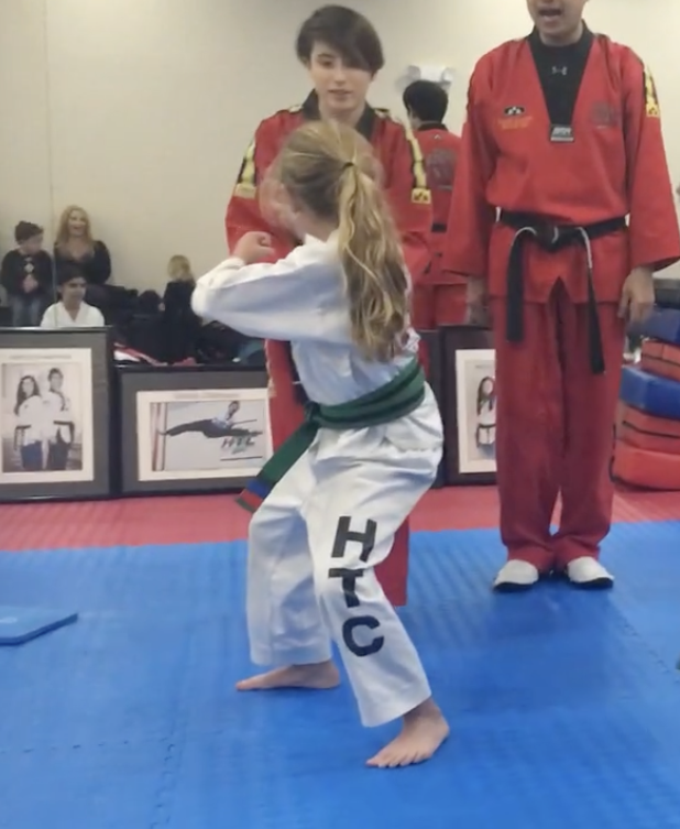 Author Shelby L. competing in Tae Kwon Do at a young age.