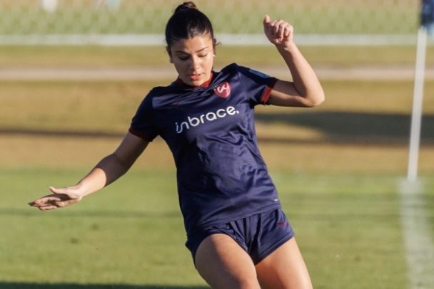 Ivy Ruberg, an ECNL soccer player playing the all at her feet during a soccer game